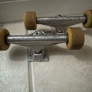 Silver Skateboard Trucks with Tan Wheels